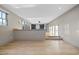 Bright living room with light hardwood floors and custom built-in shelves at 4329 Lambeth Dr, Raleigh, NC 27609