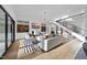 Bright living room with hardwood floors, stylish furniture, and a modern fireplace with built-ins at 4329 Lambeth Dr, Raleigh, NC 27609