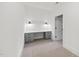 Functional office space with built-in desk, storage drawers, and overhead lighting, offering organization and comfort at 4329 Lambeth Dr, Raleigh, NC 27609