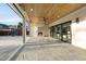 Covered patio with stone floors, wood ceiling, fireplace, and sliding glass doors at 4329 Lambeth Dr, Raleigh, NC 27609