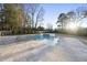 Backyard pool featuring a integrated jacuzzi and a sun-drenched stone patio at 4329 Lambeth Dr, Raleigh, NC 27609
