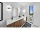 Bathroom with double vanity, designer mirrors, and modern fixtures at 523 S West St # 502, Raleigh, NC 27601