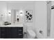 Modern bathroom with a sleek vanity, updated fixtures, and stylish artwork at 523 S West St # 502, Raleigh, NC 27601