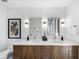 Modern bathroom featuring double vanity with wooden cabinets and quartz countertop at 523 S West St # 502, Raleigh, NC 27601
