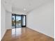 A bright and airy bedroom with hardwood floors and a balcony, offering city views at 523 S West St # 502, Raleigh, NC 27601
