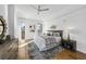 A bright bedroom with a ceiling fan, decor, and a large bed at 523 S West St # 502, Raleigh, NC 27601