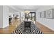 Elegant dining room with hardwood floors, seating for six, and scenic city views from the balcony at 523 S West St # 502, Raleigh, NC 27601