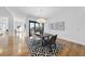 Open-concept dining room with a black and white patterned rug, and a modern light fixture at 523 S West St # 502, Raleigh, NC 27601