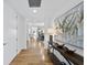 Long hallway featuring hardwood floors, modern art, and access to other rooms in the property at 523 S West St # 502, Raleigh, NC 27601