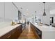 Spacious modern kitchen with a large island, pendant lights, stainless steel appliances, and ample counter space at 523 S West St # 502, Raleigh, NC 27601