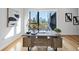 Home office with modern desk, large window and stunning city views at 523 S West St # 502, Raleigh, NC 27601