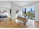 Bright office space with hardwood floors, a modern desk, and a large window with city views at 523 S West St # 502, Raleigh, NC 27601