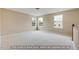 Spacious bedroom with carpet and multiple windows at 5386 Salem Woods Dr # 17, Graham, NC 27253