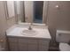 Bathroom featuring a single sink vanity, mirror, and toilet at 711 Weathervane Way, Rocky Mount, NC 27803