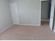 Bedroom featuring neutral walls, neutral carpet, and two doors at 711 Weathervane Way, Rocky Mount, NC 27803