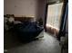Cozy bedroom featuring carpeted floors, natural light, and a comfortable bed at 711 Weathervane Way, Rocky Mount, NC 27803
