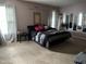 Bedroom featuring carpet floors, natural light, and decorative wall art and mirrors at 711 Weathervane Way, Rocky Mount, NC 27803