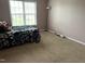 Bedroom featuring carpet, window with blinds, and an area for relaxing at 711 Weathervane Way, Rocky Mount, NC 27803