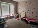 Bedroom featuring a bright window and carpeted floor at 711 Weathervane Way, Rocky Mount, NC 27803