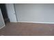 Bedroom featuring neutral walls, neutral carpet, and a door at 711 Weathervane Way, Rocky Mount, NC 27803