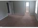 Spacious bedroom featuring neutral carpeting, a closet, and lots of natural light at 711 Weathervane Way, Rocky Mount, NC 27803