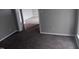 Bedroom showcasing neutral walls, carpet, and doorway views to adjacent rooms at 711 Weathervane Way, Rocky Mount, NC 27803
