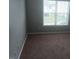 Bedroom featuring neutral walls, neutral carpet, and natural light from a window at 711 Weathervane Way, Rocky Mount, NC 27803