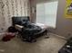 Bedroom featuring carpet floors, natural light, and plenty of decorative wall art at 711 Weathervane Way, Rocky Mount, NC 27803