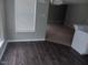 A dining space with natural lighting and new flooring leading into another room at 711 Weathervane Way, Rocky Mount, NC 27803