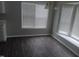 Cozy dining area with bright windows, wood flooring, and decorative lighting at 711 Weathervane Way, Rocky Mount, NC 27803