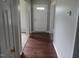 Inviting entryway features hardwood flooring and neutral paint, creating a warm welcome to the home at 711 Weathervane Way, Rocky Mount, NC 27803