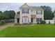 Charming two-story home with neutral siding, well-maintained lawn, and inviting curb appeal at 711 Weathervane Way, Rocky Mount, NC 27803
