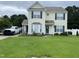 Charming two-story home with a well-manicured lawn and inviting curb appeal with attractive shutters at 711 Weathervane Way, Rocky Mount, NC 27803