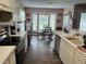 Bright eat-in kitchen with ample countertop space, modern appliances, and a bay window at 711 Weathervane Way, Rocky Mount, NC 27803