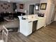 Functional kitchen area with a breakfast bar, sleek appliances, and seamless flow into the living space at 711 Weathervane Way, Rocky Mount, NC 27803