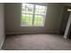 Bright living room with a large window offering natural light at 711 Weathervane Way, Rocky Mount, NC 27803