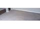 Neutral carpeted floor in the living room with white trim at 711 Weathervane Way, Rocky Mount, NC 27803