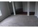 Spacious living room with neutral carpet and a view into the entry hallway at 711 Weathervane Way, Rocky Mount, NC 27803