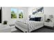 Serene bedroom featuring a comfortable bed, stylish decor, and ample natural light, creating a relaxing retreat at 923 Selby Ave, Durham, NC 27713