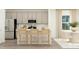 Modern kitchen features gray cabinetry, stainless appliances, and a breakfast bar with seating at 0 Hanover Dr, Sanford, NC 27330