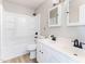 Bright bathroom featuring a double sink vanity, a tub and shower combination, and white cabinetry at 101 Rock River Rd, Morrisville, NC 27560