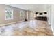 Spacious finished basement featuring tiled flooring, a bar area, and natural light at 101 Rock River Rd, Morrisville, NC 27560