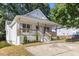 Charming one-story home with inviting front porch, fresh landscaping, and newly sealed driveway at 1011 Lowry Ave, Durham, NC 27701