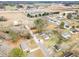 A neighborhood shows modest homes interspersed with trees and near a highway at 1012 E Harnett St, Dunn, NC 28334