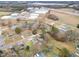 Aerial view of a neighborhood near commercial buildings and highway showing a variety of housing at 1012 E Harnett St, Dunn, NC 28334