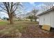 Large backyard featuring new wooden steps and exterior access door at 1012 E Harnett St, Dunn, NC 28334