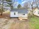 Charming home with a new front porch and gray shingled roof at 1012 E Harnett St, Dunn, NC 28334