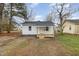 Charming single-story home with a fresh white exterior and inviting front porch at 1012 E Harnett St, Dunn, NC 28334