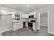 Modern kitchen featuring stainless steel appliances, white cabinets, and granite countertops at 1012 E Harnett St, Dunn, NC 28334