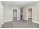 Inviting living room featuring sleek gray floors and natural light, with multiple entryways at 1012 E Harnett St, Dunn, NC 28334